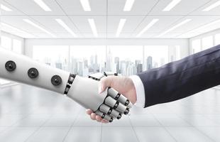 homme d'affaires serrer la main avec une machine ou un robot photo