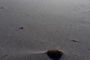 fond naturel de sable volcanique noir du kamtchatka photo