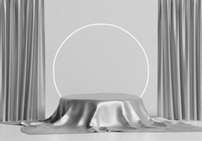 Présentoir de podium de produit rond 3d recouvert de plis de draperie en tissu de couleur argent isolé sur fond blanc photo