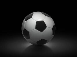 ballon de football sur fond noir photo