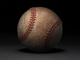 balle de baseball sur fond noir photo