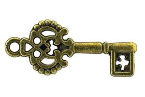 clé vintage clé dorée antique sur fond blanc chemin de détourage photo