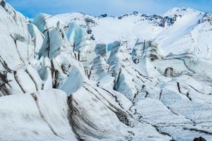le mur de glace du glacier skaftafell du parc national du vatnajokull dans le sud de l'islande. photo