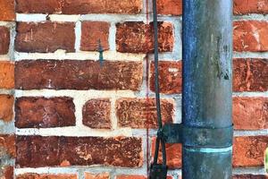 vieux mur de briques. texture du vieux fond panoramique de mur de brique patiné photo