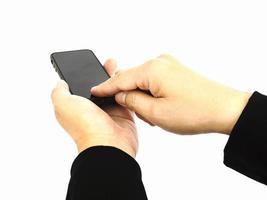 les mains d'une entreprise utilisent un téléphone mobile. la photo est isolée sur un chemin de détourage blanc et inclus.