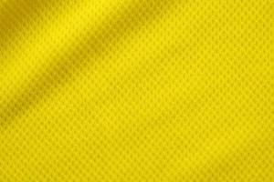 couleur jaune maillot de football vêtements tissu texture vêtements de sport arrière-plan, gros plan photo