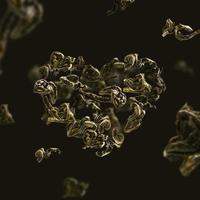 feuilles de thé vert en vol en forme de coeur photo