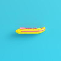 bateau gonflable jaune sur fond bleu vif dans des tons pastel photo