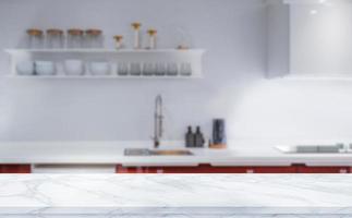 plateau de table en marbre blanc sur fond de cuisine floue pour le montage ou l'affichage de vos produits