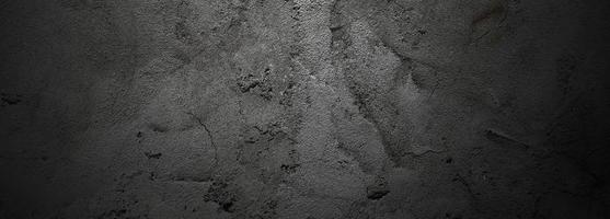 brosser les rayures sur le mur. murs sombres effrayants, texture de ciment en béton noir légèrement clair pour le fond. photo