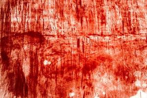 fond rouge, mur sanglant effrayant. mur blanc avec éclaboussures de sang pour fond d'halloween. photo