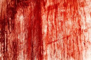 fond rouge, mur sanglant effrayant. mur blanc avec éclaboussures de sang pour fond d'halloween. photo