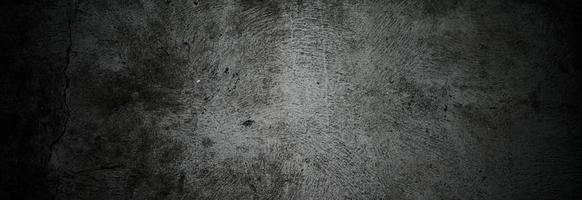 murs sombres effrayants, texture de ciment en béton noir légèrement clair pour le fond. brosser les rayures sur le mur photo