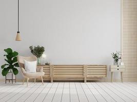 meuble tv sur le mur blanc du salon avec fauteuil, design minimaliste. photo