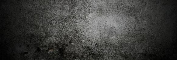 murs sombres effrayants, texture de ciment en béton noir légèrement clair pour le fond. brosser les rayures sur le mur photo