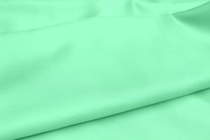 Texture de tissu satin vert doux arrière-plan flou photo