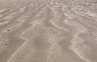 photo d'arrière-plan et de texture de sable de couleur marron.