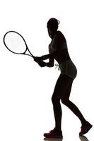 joueur femme tennis, dans, studio, silhouette, isolé photo