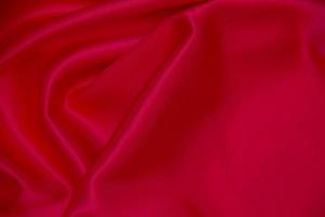 texture de fond de vagues de tissu rouge. photo