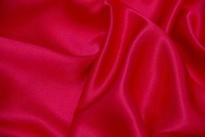 texture de fond de vagues de tissu rouge. photo
