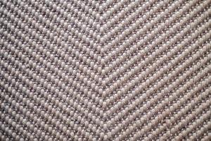 fond gros plan de tapis de couleur marron naturel tissé à plat, fait de matériaux naturels, fait de jute, de tapis lisses de style indien photo