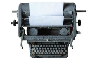 Old vintage machine à écrire couverte de poussière avec feuille de papier isolé sur fond blanc photo