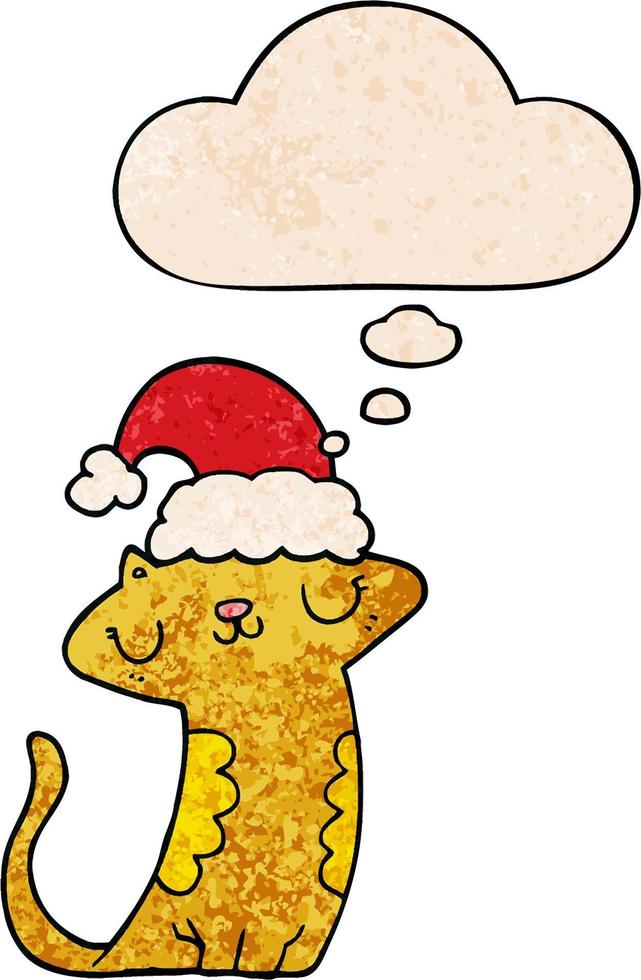 chat de dessin animé mignon portant un chapeau de noël et une bulle de pensée dans le style de motif de texture grunge vecteur