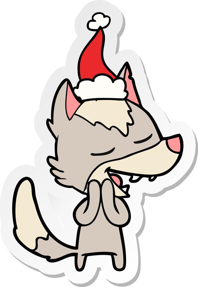 autocollant dessin animé d'un loup riant portant un bonnet de noel vecteur