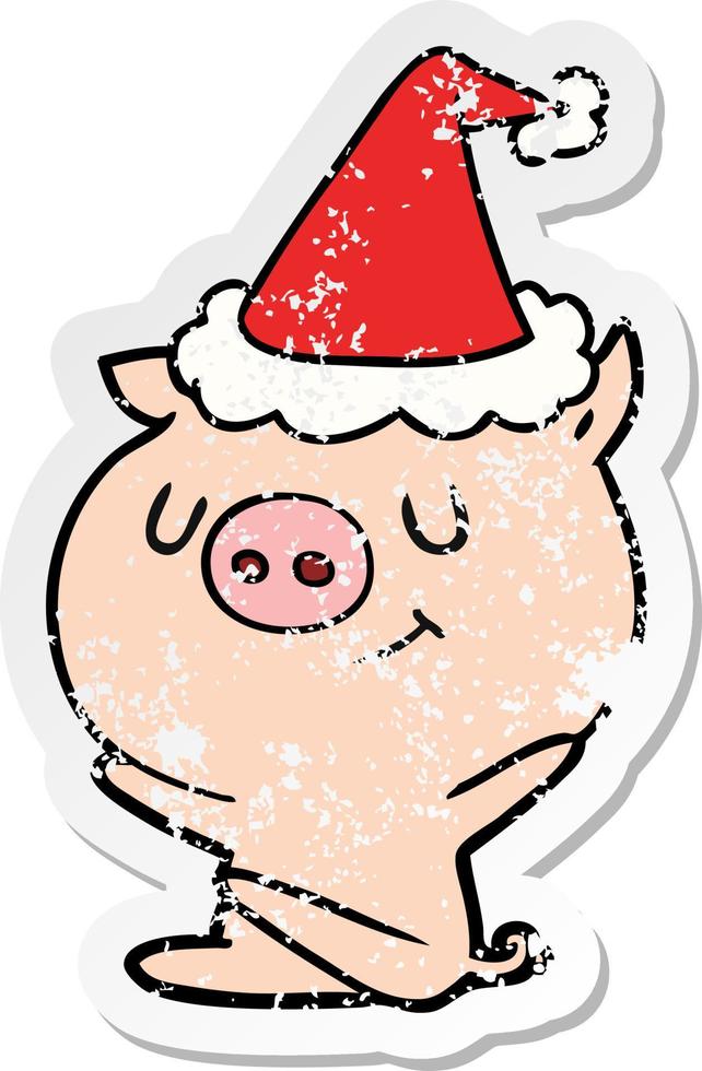 dessin animé autocollant en détresse heureux d'un cochon portant un bonnet de noel vecteur