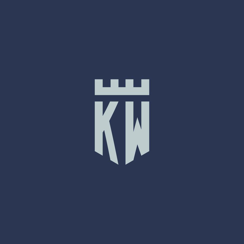 monogramme du logo kw avec un château de forteresse et un design de style bouclier vecteur