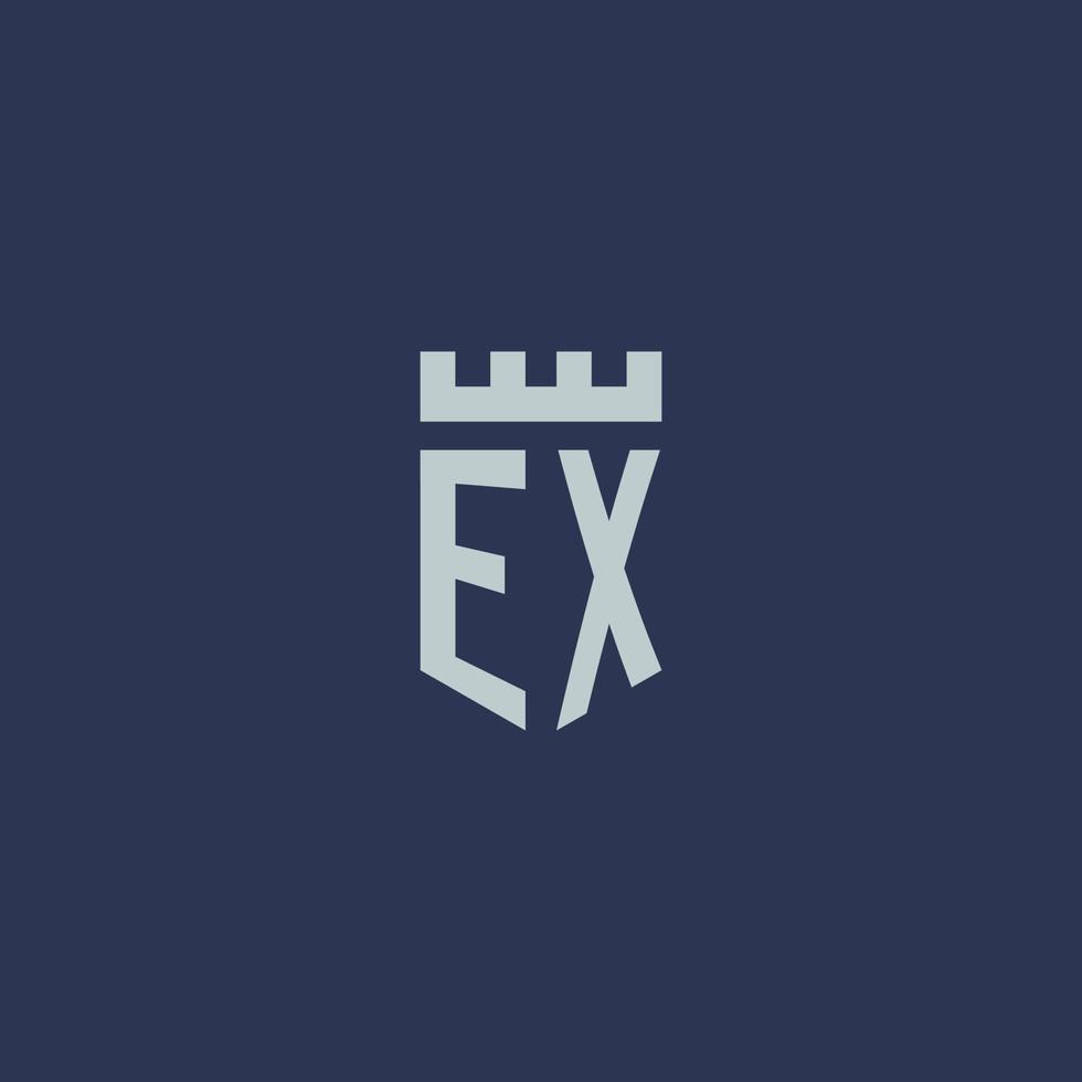 monogramme ex logo avec château de forteresse et design de style bouclier vecteur