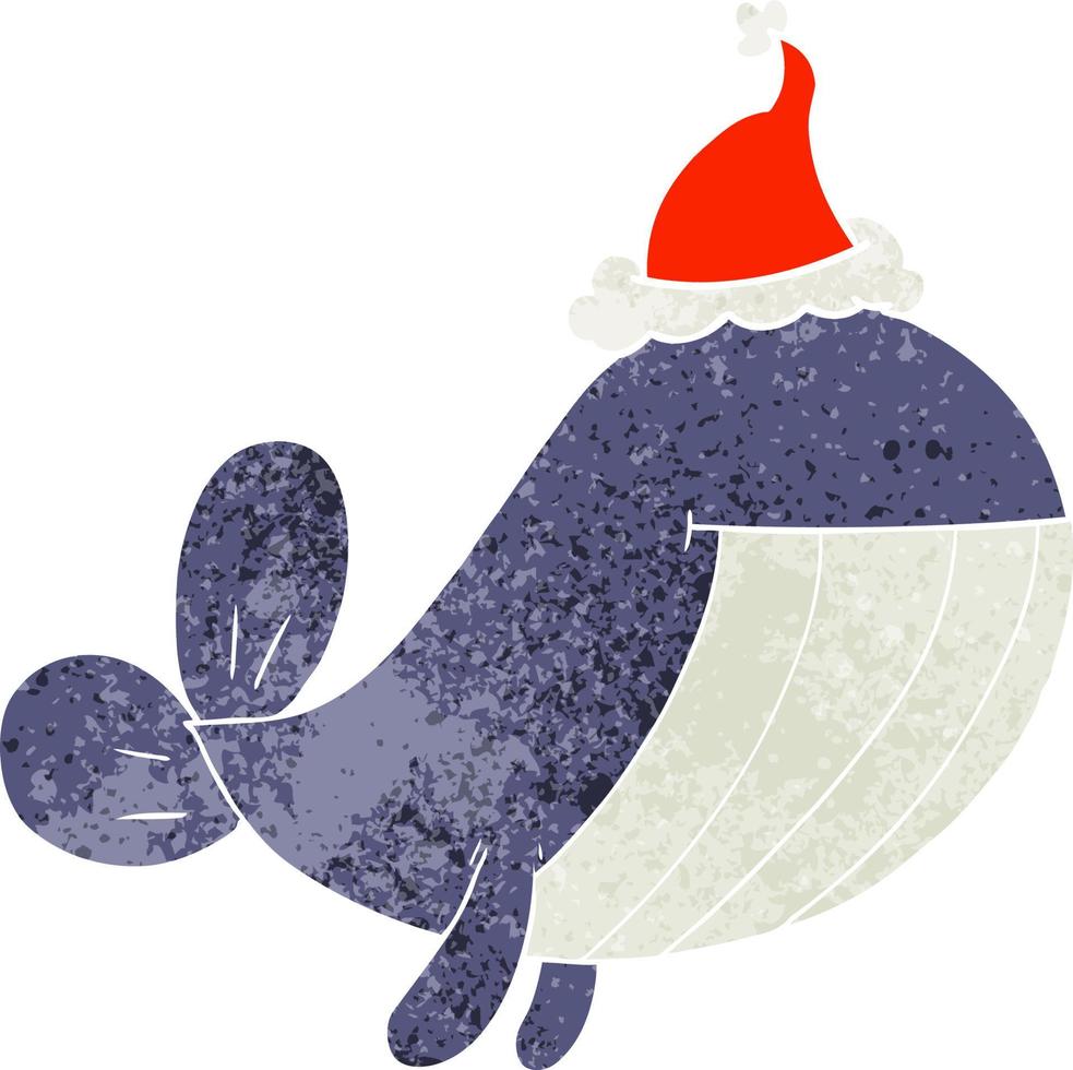 dessin animé rétro d'une baleine portant un bonnet de noel vecteur