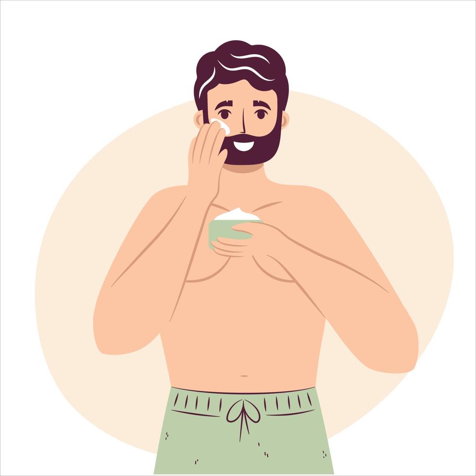 concept de routine de soins de la peau. heureux jeune homme appliquant une crème ou une lotion hydratante pour le visage sur la joue, beau mâle barbu bénéficiant d'une procédure de soin de la peau. vecteur