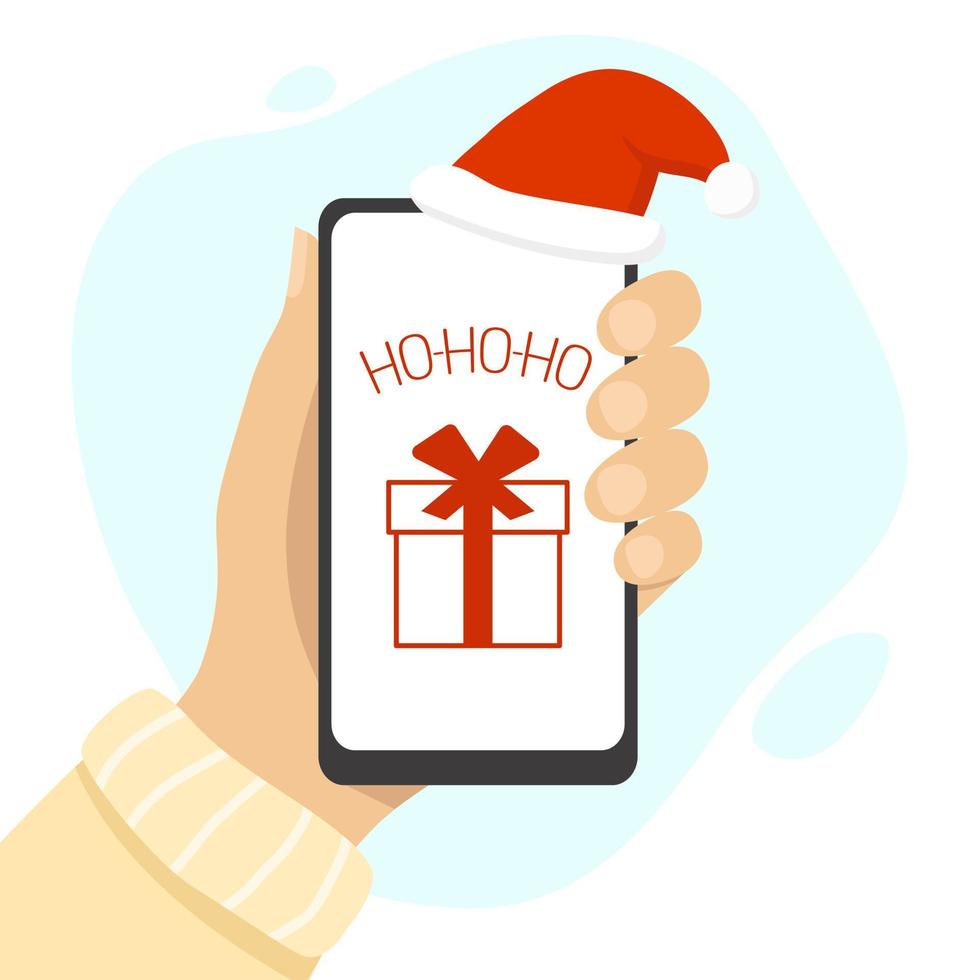main humaine tenant un téléphone portable avec la phrase ho-ho-ho et l'icône actuelle sur l'écran. cadeau de Noël. bonnet de noel rouge. illustration vectorielle vecteur