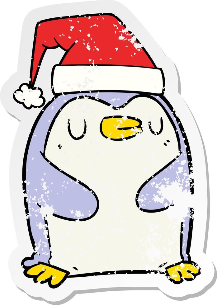 autocollant en détresse d'un pingouin de dessin animé portant un chapeau de noël vecteur