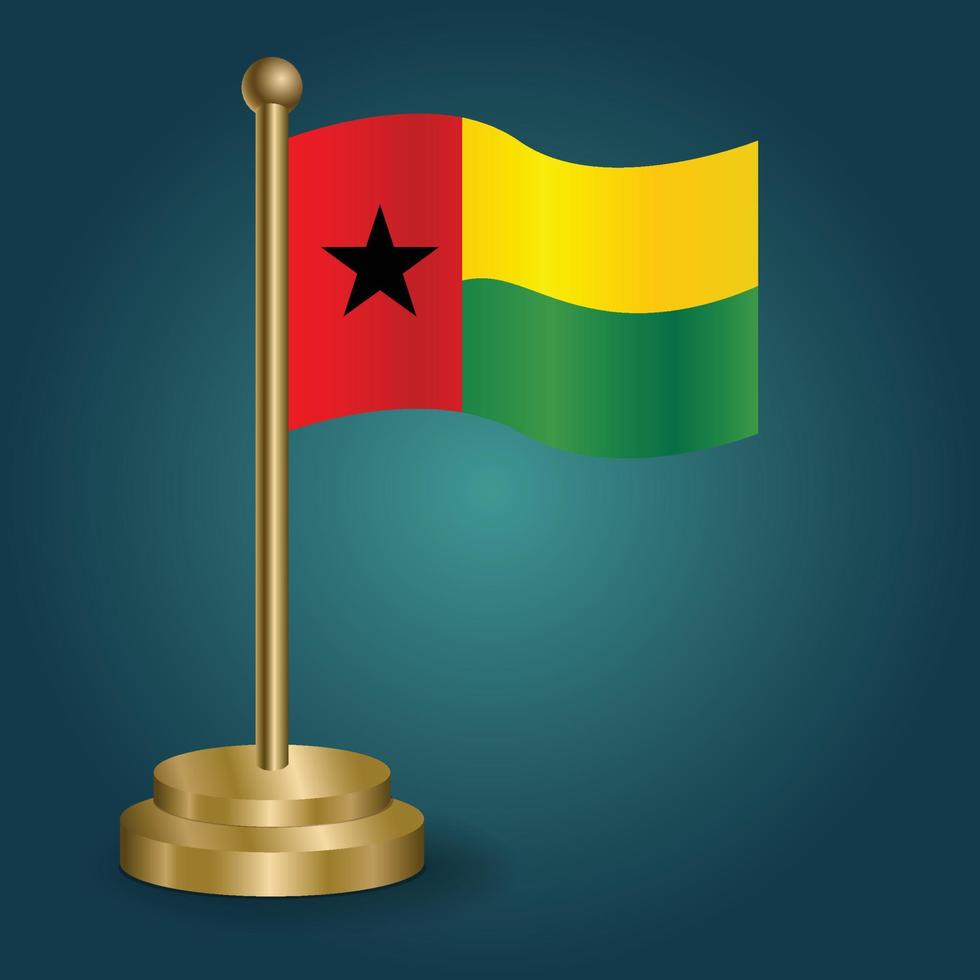 drapeau national de la guinée bissau sur le pôle d'or sur fond sombre isolé de gradation. drapeau de table, illustration vectorielle vecteur