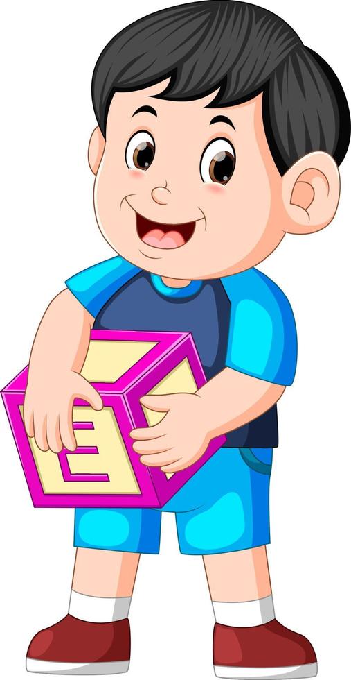 joli garçon tenant un cube alphabet vecteur