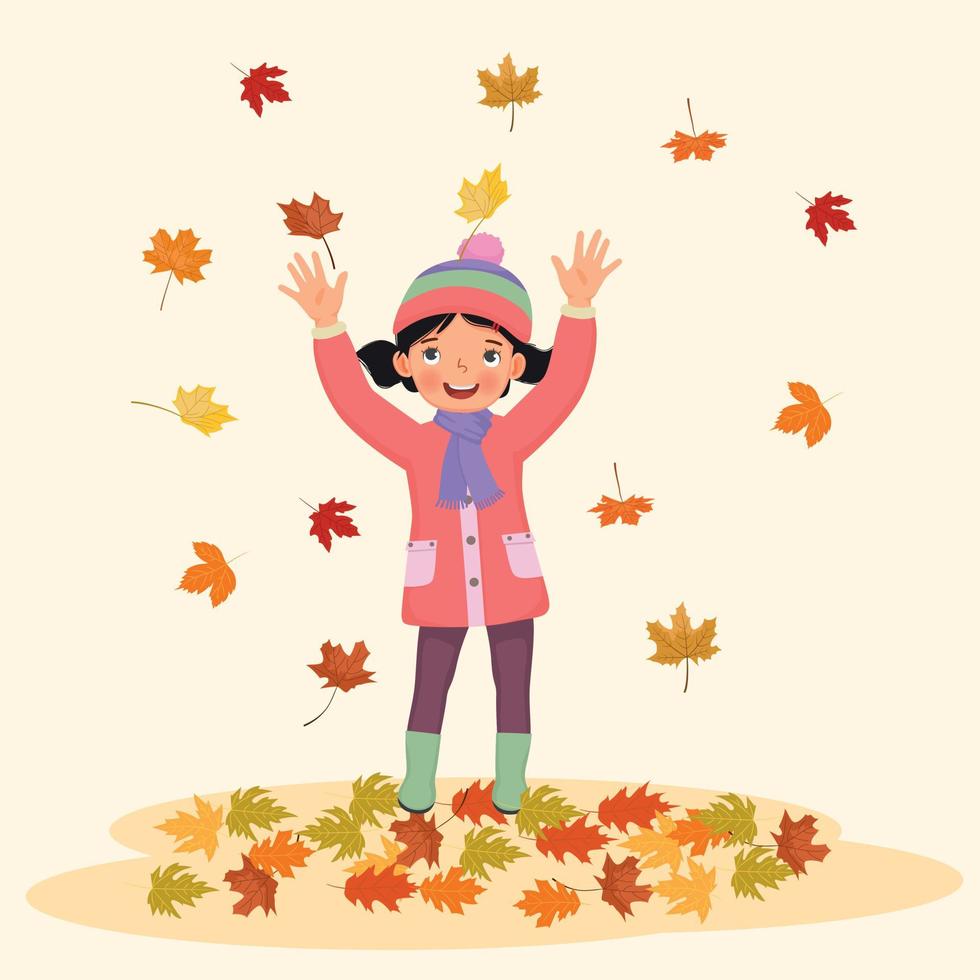 bonne petite fille jouant dehors avec des feuilles mortes en automne vecteur