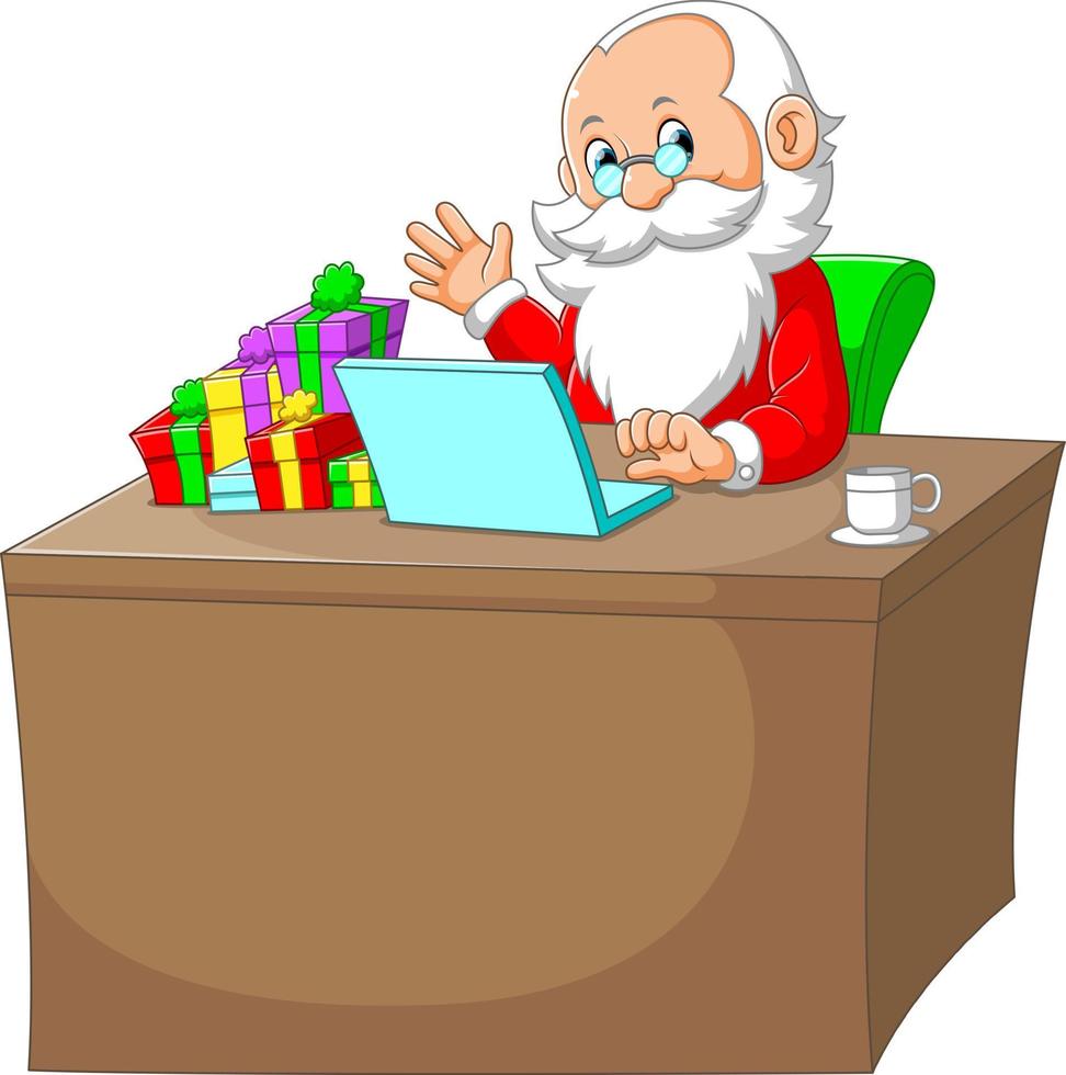 le père noël assis dans son bureau avec l'ordinateur portable et le cadeau dans son bureau vecteur