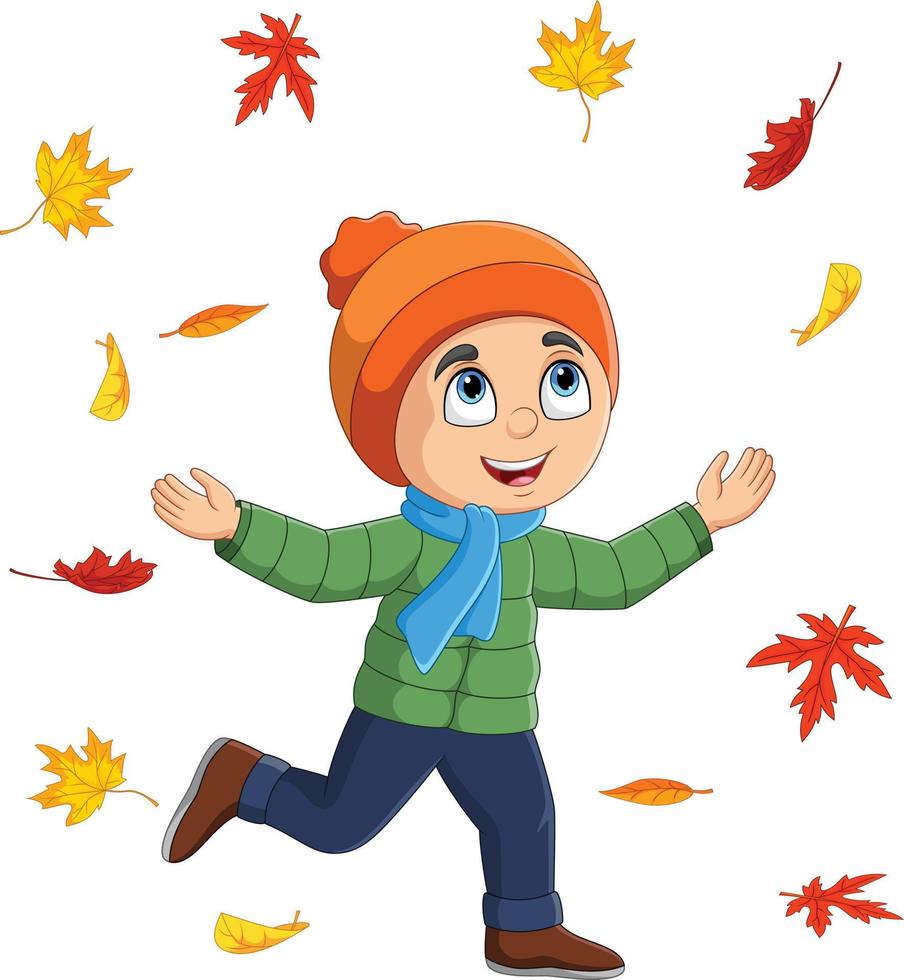 dessin animé petit garçon jetant des feuilles d'automne vecteur