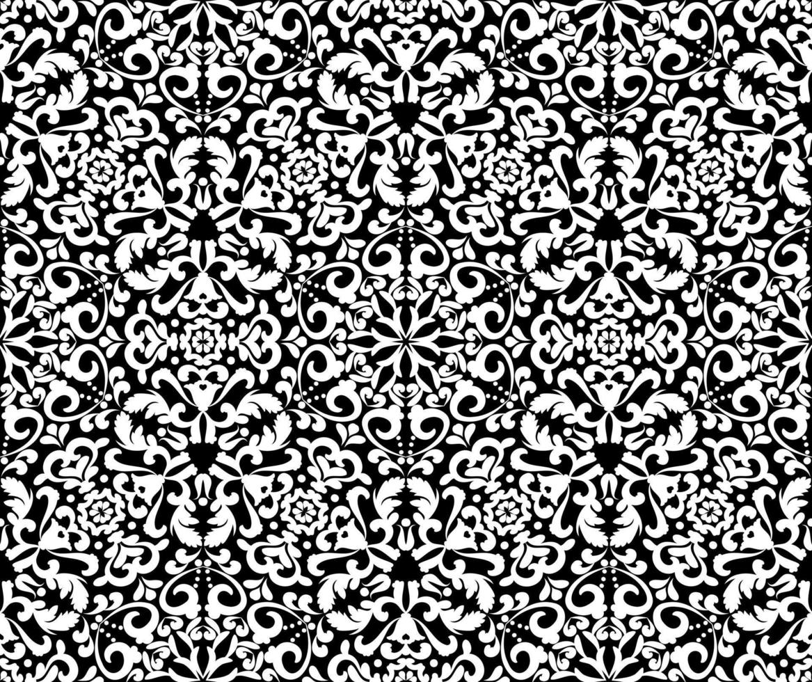 motif blanc orné sur fond noir. motif élégant sans couture de demaski. motif dentelle. couleur noir et blanc. motif vintage graphique vectoriel. pour le tissu, le carrelage, le papier peint ou l'emballage. vecteur