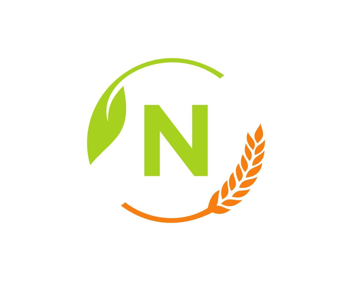 logo de l'agriculture sur le concept de lettre n. création de logo d'agriculture et d'élevage. agro-industrie, éco-ferme et conception de campagne rurale vecteur