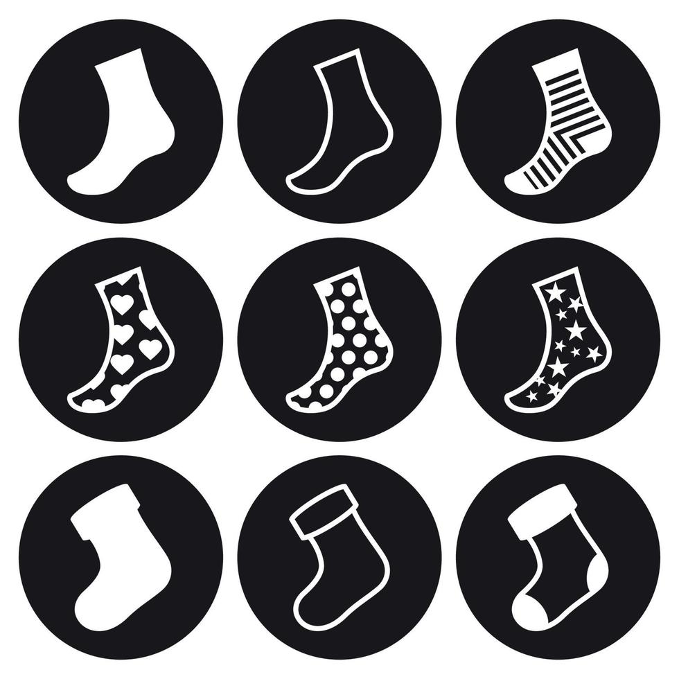 ensemble d'icônes de chaussettes et de bas de noël. blanc sur fond noir vecteur