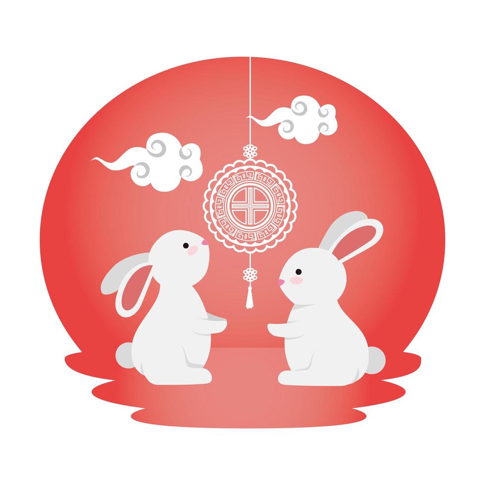lapins mignons et petits avec des lampes chinoises suspendues vecteur