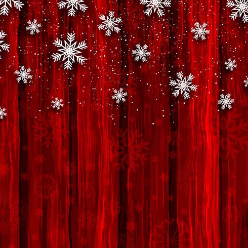 Flocons de neige de Noël sur fond de bois rouge vecteur