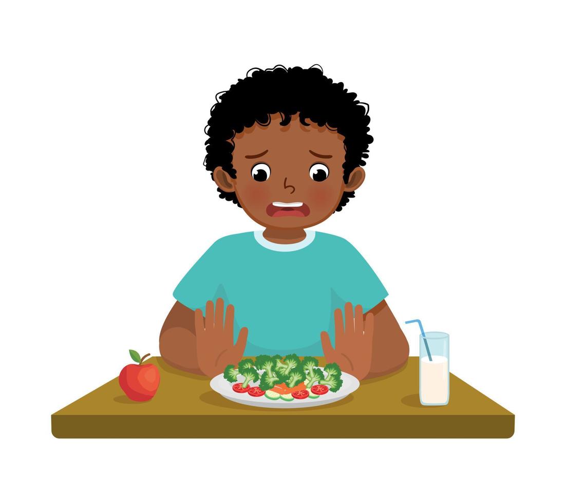 mignonne peu africain garçon pointilleux mangeur refusant à manger des légumes vecteur