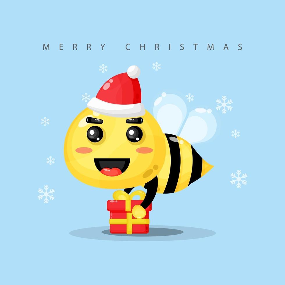 mignonne mascotte d'abeille apporte une boîte cadeau le jour de Noël vecteur