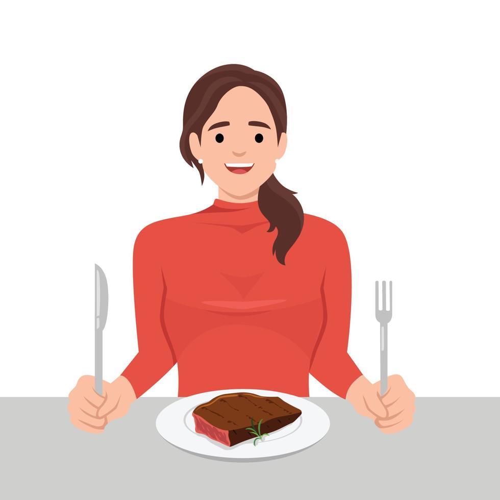 Jeune femme prendre plaisir en mangeant steak dans le plat en portant couteau et fourchette comme elle est prêt à manger vecteur