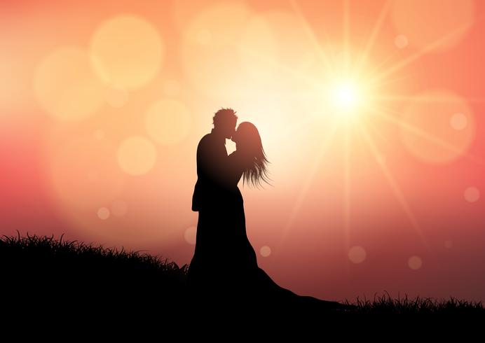 Silhouette d'un couple de mariage sur fond de coucher de soleil vecteur