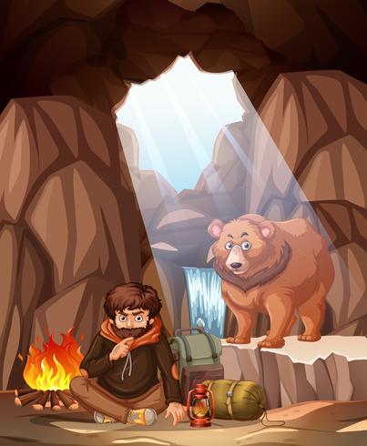Un homme campant dans la grotte de l&#39;ours vecteur